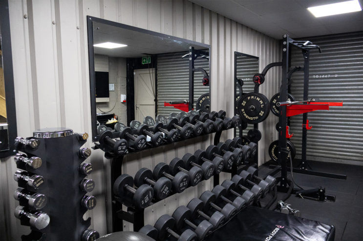 All of the free standing weights up against the wall