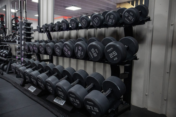 All of the free standing weights up against the wall