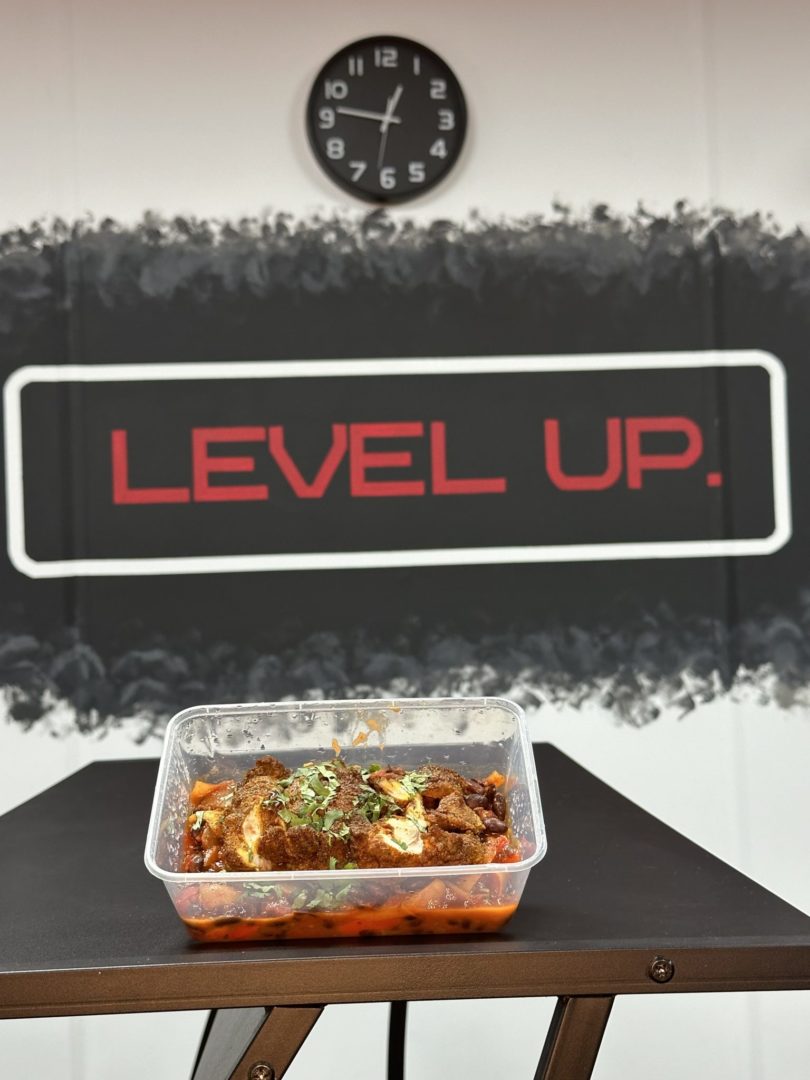 Mexican Chicken Bean Curry, with the level up logo behind the food